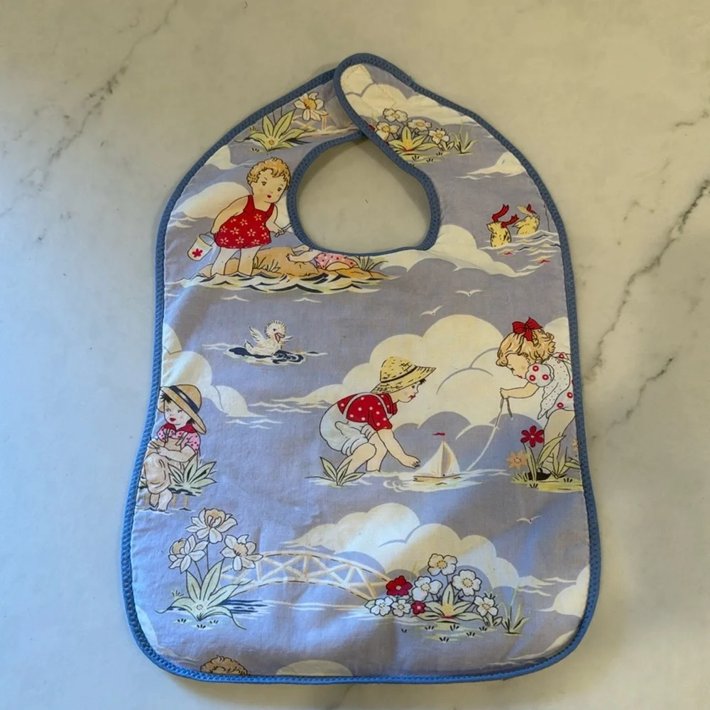 Adorable vintage beach print bib with terry backing